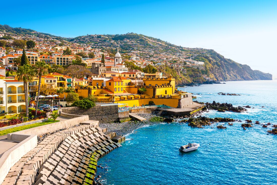 Bright yellow buildings of the city Funchal in Madeira island, Portugal