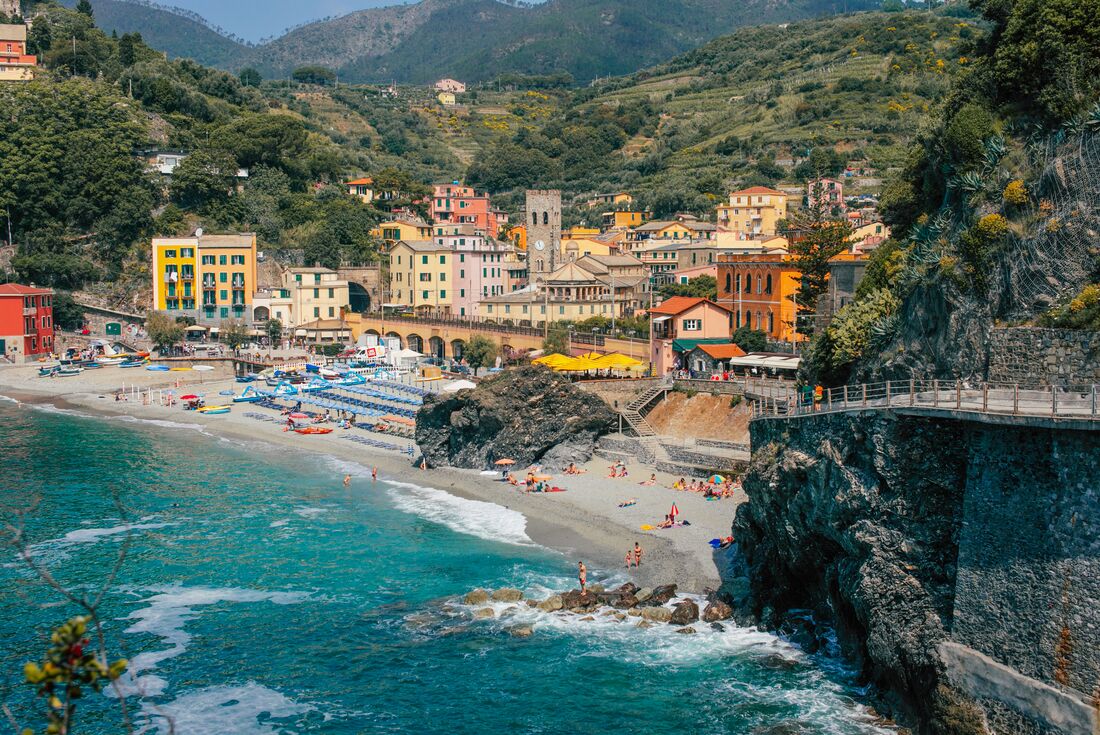 Colourful house sit on the coast line and mountains of Cinque Terre
