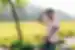Traveller fixes hair after a long bicycle ride in the countryside of Ninh Binh