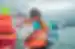 Traveller holding ice shard on Jokulsarlon Glacier Lagoon Boat Tour