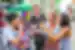 Group of friendly 18 to 35 travellers gather to try some street food balls in Bangkok