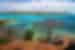 Blue and green ocean water stretches out away from the edge of Thursday Island in the Torres Strait off of northern Queensland