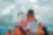 Traveller holding massive ice shard on Jokulsarlon Glacier Lagoon boat tour