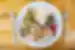 Plate of fresh healthy food with meat on a neat plate with wooden table