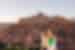 Travellers and leader overlook the city of Ait Benhaddou, Morocco