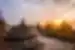 An exposed Buddha usually ensconced in a stupa faces the sunrise at Borobudur temple in Indonesia