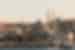 View of mosque and surrounding city along the river with boats in Istanbul, Turkey