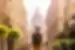 Traveller approaches St Stephen's Basilica down a planted street in Budapest in summer