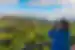 Traveller looking out over Vinales Valley with biioculars in the beautiful green belt of Cuba
