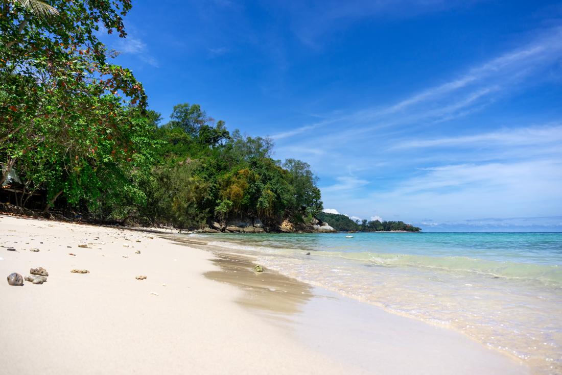 White sands of a beach on Dinawan Island off the northwest coast of Borneo in Malaysia